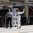 Jenson Button (GBR) McLaren with his trainer Mike Collier (GBR)  waves to the crowd after Q1 at Formula One World Championship, Rd18, United States Grand Prix, Qualifying, Circuit of the Americas, Austin, Texas, USA, Saturday 22 October 2016. © Sutton Images