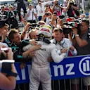 Race winner Lewis Hamilton (GBR) Mercedes AMG F1 celebrates with the team in parc ferme at Formula One World Championship, Rd18, United States Grand Prix, Race, Circuit of the Americas, Austin, Texas, USA, Sunday 23 October 2016. © Sutton Images