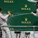 Nico Rosberg (GER) Mercedes AMG F1 and Lewis Hamilton (GBR) Mercedes AMG F1 celebrate on the podium with the champagne at Formula One World Championship, Rd18, United States Grand Prix, Race, Circuit of the Americas, Austin, Texas, USA, Sunday 23 October 2016. © Sutton Images