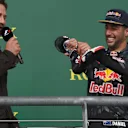 Daniel Ricciardo (AUS) Red Bull Racing offers Gerard Butler (GBR) Actor a drink from his shoe on the podium at Formula One World Championship, Rd18, United States Grand Prix, Race, Circuit of the Americas, Austin, Texas, USA, Sunday 23 October 2016. © Sutton Images