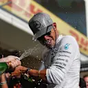 Race winner Lewis Hamilton (GBR) Mercedes AMG F1 celebrates with the team and the champagne at Formula One World Championship, Rd18, United States Grand Prix, Race, Circuit of the Americas, Austin, Texas, USA, Sunday 23 October 2016. © Sutton Images