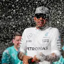 Race winner Lewis Hamilton (GBR) Mercedes AMG F1 celebrates with the team and the champagne at Formula One World Championship, Rd18, United States Grand Prix, Race, Circuit of the Americas, Austin, Texas, USA, Sunday 23 October 2016. © Sutton Images
