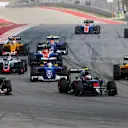 Daniil Kvyat (RUS) Scuderia Toro Rosso STR11 and Fernando Alonso (ESP) McLaren MP4-31 battle on lap one at Formula One World Championship, Rd18, United States Grand Prix, Race, Circuit of the Americas, Austin, Texas, USA, Sunday 23 October 2016. © Sutton Images