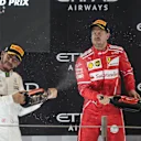 Lewis Hamilton (GBR) Mercedes AMG F1 and Sebastian Vettel (GER) Ferrari celebrate on the podium at Formula One World Championship, Rd20, Abu Dhabi Grand Prix, Race, Yas Marina Circuit, Abu Dhabi, UAE, Sunday 26 November 2017. © Manuel Goria/Sutton Images