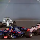 Daniil Kvyat (RUS) Scuderia Toro Rosso STR12, Carlos Sainz jr (ESP) Scuderia Toro Rosso STR12 and Sergio Perez (MEX) Force India VJM10 battle for position F1 World Championship, Australian Grand Prix. ©Sutton Motorsport Images