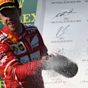 Sebastian Vettel (GER) Ferrari celebrates on the podium with the champagne at Formula One World Championship, Rd1, Australian Grand Prix, Race, Albert Park, Melbourne, Australia, Sunday 26 March 2017. © Sutton Motorsport Images