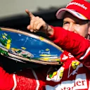 Race winner Sebastian Vettel (GER) Ferrari celebrates on the podium with the trophy at Formula One World Championship, Rd1, Australian Grand Prix, Race, Albert Park, Melbourne, Australia, Sunday 26 March 2017. © Sutton Motorsport Images