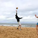 Sergio Perez (MEX) and Esteban Ocon (FRA) of Force India play Beach Volleyball with Tamsin Hinchley (AUS) Olympic Volleyball player. F1 World Championship, Australian Grand Prix, Preparations, Melbourne, Australia, 22 March 2017. ©Sutton Motorsport Images