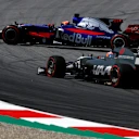 Romain Grosjean (FRA) Haas VF-17 with front puncture and Daniil Kvyat (RUS) Scuderia Toro Rosso STR12 spins at Formula One World Championship, Rd9, Austrian Grand Prix, Practice, Spielberg, Austria, Friday 7 July 2017. © Sutton Images