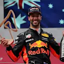 Daniel Ricciardo (AUS) Red Bull Racing celebrates on the podium with the trophy and the champagne at Formula One World Championship, Rd9, Austrian Grand Prix, Race, Spielberg, Austria, Sunday 9 July 2017. © Sutton Images