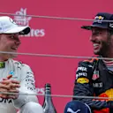 race winner Valtteri Bottas (FIN) Mercedes AMG F1 and Daniel Ricciardo (AUS) Red Bull Racing celebrate on the podium at Formula One World Championship, Rd9, Austrian Grand Prix, Race, Spielberg, Austria, Sunday 9 July 2017. © Sutton Images