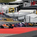 Max Verstappen (NED) Red Bull Racing RB13, Fernando Alonso (ESP) McLaren MCL32 and Daniil Kvyat (RUS) Scuderia Toro Rosso STR12 collide at the start of the race at Formula One World Championship, Rd9, Austrian Grand Prix, Race, Spielberg, Austria, Sunday