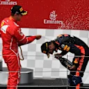 Sebastian Vettel (GER) Ferrari and Daniel Ricciardo (AUS) Red Bull Racing celebrate on the podium at Formula One World Championship, Rd9, Austrian Grand Prix, Race, Spielberg, Austria, Sunday 9 July 2017. © Sutton Images