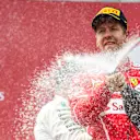 Sebastian Vettel (GER) Ferrari celebrates on the podium with the champagne at Formula One World Championship, Rd9, Austrian Grand Prix, Race, Spielberg, Austria, Sunday 9 July 2017. © Sutton Images