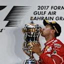 Race winner Sebastian Vettel (GER) Ferrari celebrates on the podium with the trophy at Formula One World Championship, Rd3, Bahrain Grand Prix Race, Bahrain International Circuit, Sakhir, Bahrain, Sunday 16 April 2017. © Sutton Motorsport Images