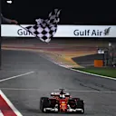 Race winner Sebastian Vettel (GER) Ferrari SF70-H takes the chequered flag at Formula One World Championship, Rd3, Bahrain Grand Prix Race, Bahrain International Circuit, Sakhir, Bahrain, Sunday 16 April 2017. © Sutton Motorsport Images