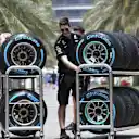 Mercedes AMG F1 mechanic and Red Bull Racing mechanic with Pirelli tyres at Formula One World Championship, Rd3, Bahrain Grand Prix Preparations, Bahrain International Circuit, Sakhir, Bahrain, Thursday 13 April 2017. © Sutton Motorsport Images