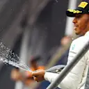 Race winner Lewis Hamilton (GBR) Mercedes AMG F1 celebrates on the podium with the champagne Formula One World Championship, Rd12, Belgian Grand Prix, Race, Spa Francorchamps, Belgium, Sunday 27 August 2017. © Sutton Images