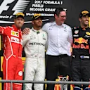 (L to R): Sebastian Vettel (GER) Ferrari, Lewis Hamilton (GBR) Mercedes AMG F1, Andy Shovlin (GBR) Mercedes AMG F1 Race Engineer and Daniel Ricciardo (AUS) Red Bull Racing celebrate on the podium at Formula One World Championship, Rd12, Belgian Grand Prix