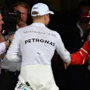 Pole sitter Valtteri Bottas (FIN) Mercedes AMG F1 celebrates with Kimi Raikkonen (FIN) Ferrari in parc ferme as Johnny Herbert (GBR) Sky TV looks on at Formula One World Championship, Rd19, Brazilian Grand Prix, Qualifying, Interlagos, Sao Paulo, Brazil, Saturday 11 November 2017. © Mark Sutton/Sutton Images