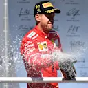 Race winner Sebastian Vettel (GER) Ferrari celebrates on the podium with the champagne at Formula One World Championship, Rd19, Brazilian Grand Prix, Race, Interlagos, Sao Paulo, Brazil, Sunday 12 November 2017. © Mark Sutton/Sutton Images