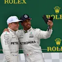 Valtteri Bottas (FIN) Mercedes AMG F1 and Lewis Hamilton (GBR) Mercedes AMG F1 selfie on the podium at Formula One World Championship, Rd10, British Grand Prix, Race, Silverstone, England, Sunday 16 July 2017. © Sutton Images