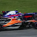 Fernando Alonso (ESP) McLaren MCL32 and Carlos Sainz jr (ESP) Scuderia Toro Rosso STR12 at Formula One World Championship, Rd7, Canadian Grand Prix, Race, Montreal, Canada, Sunday 11 June 2017. © Sutton Images