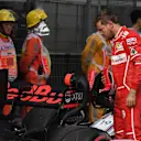 Sebastian Vettel (GER) Ferrari looks at the Red Bull Racing RB13 in parc ferme at Formula One World Championship, Rd2, Chinese Grand Prix, Qualifying, Shanghai, China, Saturday 8 April 2017. © Sutton Motorsport Images