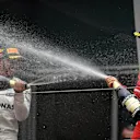 Sebastian Vettel (GER) Ferrari and Lewis Hamilton (GBR) Mercedes AMG F1 celebrate on the podium with the champagne at Formula One World Championship, Rd2, Chinese Grand Prix, Race, Shanghai, China, Sunday 9 April 2017. © Sutton Motorsport Images
