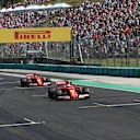 Pole sitter Sebastian Vettel (GER) Ferrari SF70-H and Kimi Raikkonen (FIN) Ferrari SF70-H arrive in parc ferme at Formula One World Championship, Rd11, Hungarian Grand Prix, Qualifying, Hungaroring, Hungary, Saturday 29 July 2017. © Sutton Images