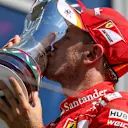 Race winner Sebastian Vettel (GER) Ferrari celebrates on the podium with the trophy at Formula One World Championship, Rd11, Hungarian Grand Prix, Race, Hungaroring, Hungary, Sunday 30 July 2017. © Sutton Images