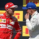 Race winner Sebastian Vettel (GER) Ferrari celebrates on the podium with Valtteri Bottas (FIN) Mercedes AMG F1 at Formula One World Championship, Rd11, Hungarian Grand Prix, Race, Hungaroring, Hungary, Sunday 30 July 2017. © Sutton Images