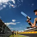 Grid girl fires a T-Shirt into the crowd with a T-Shirt Gun at Formula One World Championship, Rd11, Hungarian Grand Prix, Race, Hungaroring, Hungary, Sunday 30 July 2017. © Sutton Images