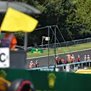 Yellow flag is waved with race retiree Daniel Ricciardo (AUS) Red Bull Racing RB13 in the background at Formula One World Championship, Rd11, Hungarian Grand Prix, Race, Hungaroring, Hungary, Sunday 30 July 2017. © Sutton Images