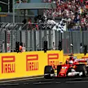 Race winner Sebastian Vettel (GER) Ferrari SF70-H takes the chequered flag at Formula One World Championship, Rd11, Hungarian Grand Prix, Race, Hungaroring, Hungary, Sunday 30 July 2017. © Sutton Images