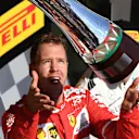 Race winner Sebastian Vettel (GER) Ferrari celebrates on the podium with the trophy at Formula One World Championship, Rd11, Hungarian Grand Prix, Race, Hungaroring, Hungary, Sunday 30 July 2017. © Sutton Images