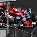 Race winner Sebastian Vettel (GER) Ferrari SF70-H takes the chequered flag at Formula One World Championship, Rd11, Hungarian Grand Prix, Race, Hungaroring, Hungary, Sunday 30 July 2017. © Sutton Images