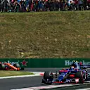 Carlos Sainz (ESP) Scuderia Toro Rosso STR12 leads Fernando Alonso (ESP) McLaren MCL32 at Formula One World Championship, Rd11, Hungarian Grand Prix, Race, Hungaroring, Hungary, Sunday 30 July 2017. © Sutton Images