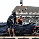 The crashed car of Carlos Sainz (ESP) Scuderia Toro Rosso STR12 is recovered after FP1 at Formula One World Championship, Rd16, Japanese Grand Prix, Practice, Suzuka, Japan, Friday 6 October 2017. © Rubio/Sutton Images