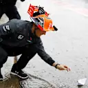 Stoffel Vandoorne (BEL) McLaren floats a paper boat in a flooded pit lane at Formula One World Championship, Rd16, Japanese Grand Prix, Practice, Suzuka, Japan, Friday 6 October 2017. © Rubio/Sutton Images