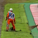 Marshals and loose astro turf at Formula One World Championship, Rd16, Japanese Grand Prix, Qualifying, Suzuka, Japan, Saturday 7 October 2017. © Kym Illman/Sutton Images