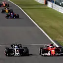 Romain Grosjean (FRA) Haas VF-17 and Kimi Raikkonen (FIN) Ferrari SF70-H battle for position at Formula One World Championship, Rd16, Japanese Grand Prix, Race, Suzuka, Japan, Sunday 8 October 2017. © Manuel Goria/Sutton Images