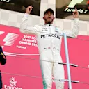 Race winner Lewis Hamilton (GBR) Mercedes AMG F1 celebrates on the podium with Max Verstappen (NED) Red Bull Racing and Daniel Ricciardo (AUS) Red Bull Racing at Formula One World Championship, Rd16, Japanese Grand Prix, Race, Suzuka, Japan, Sunday 8 October 2017. © Kym Illman/Sutton Images