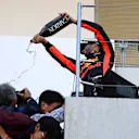 Daniel Ricciardo (AUS) Red Bull Racing celebrates on the podium with the champagne and the fans and photographers at Formula One World Championship, Rd16, Japanese Grand Prix, Race, Suzuka, Japan, Sunday 8 October 2017. © Kym Illman/Sutton Images