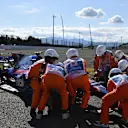 Marshals recover the car of race retiree Carlos Sainz (ESP) Scuderia Toro Rosso STR12 at Formula One World Championship, Rd16, Japanese Grand Prix, Race, Suzuka, Japan, Sunday 8 October 2017. © Mark Sutton/Sutton Images