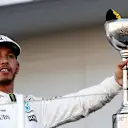 Race winner Lewis Hamilton (GBR) Mercedes AMG F1 celebrates on the podium with the trophy at Formula One World Championship, Rd16, Japanese Grand Prix, Race, Suzuka, Japan, Sunday 8 October 2017. © Glenn Dunbar/LAT/Sutton Images
