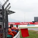 Marshal waves the red flag at Formula One World Championship, Rd15, Malaysian Grand Prix, Practice, Sepang, Malaysia, Friday 29 September 2017. © Manuel Goria/Sutton Images