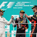 Lewis Hamilton (GBR) Mercedes AMG F1, race winner Max Verstappen (NED) Red Bull Racing and Daniel Ricciardo (AUS) Red Bull Racing celebrate on the podium with the champagne at Formula One World Championship, Rd15, Malaysian Grand Prix, Race, Sepang, Malaysia, Sunday 1 October 2017. © Manuel Goria/Sutton Images