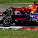 Pierre Gasly (FRA) Scuderia Toro Rosso STR12 battles with Sebastian Vettel (GER) Ferrari SF70-H at Formula One World Championship, Rd15, Malaysian Grand Prix, Race, Sepang, Malaysia, Sunday 1 October 2017. © Rubio/Sutton Images