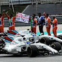 Felipe Massa (BRA) Williams FW40 and Lance Stroll (CDN) Williams FW40 celebrate with the race marshals at the end of the race at Formula One World Championship, Rd15, Malaysian Grand Prix, Race, Sepang, Malaysia, Sunday 1 October 2017. © Rubio/Sutton Images